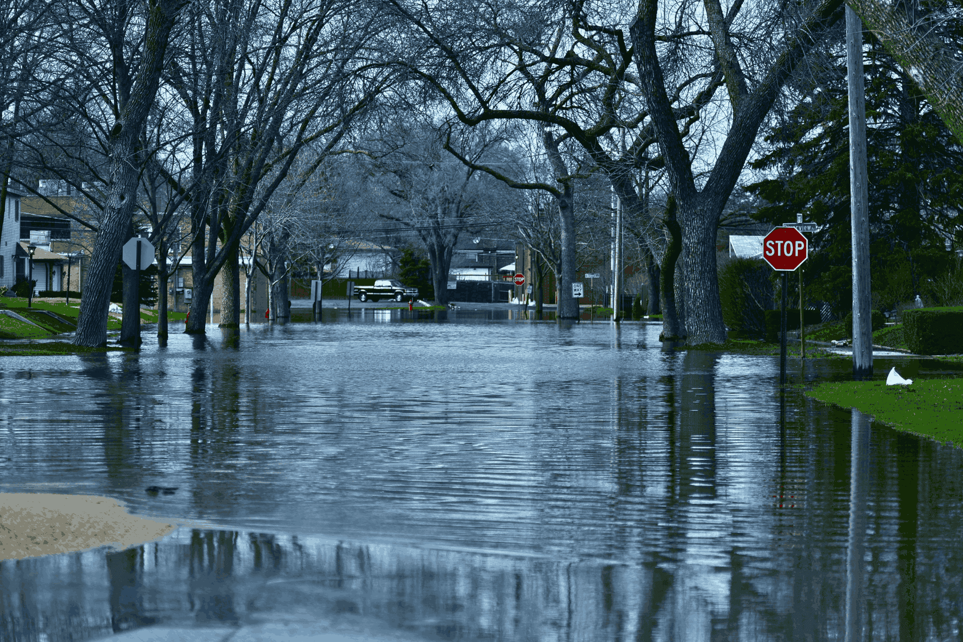 A neighbourhood street completely flooded with water